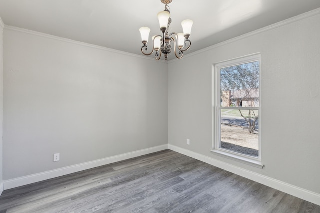 4018 Tobin Trl, Rowlett, TX 75088 - spare room with a chandelier, wood finished floors, ornamental molding, and baseboards