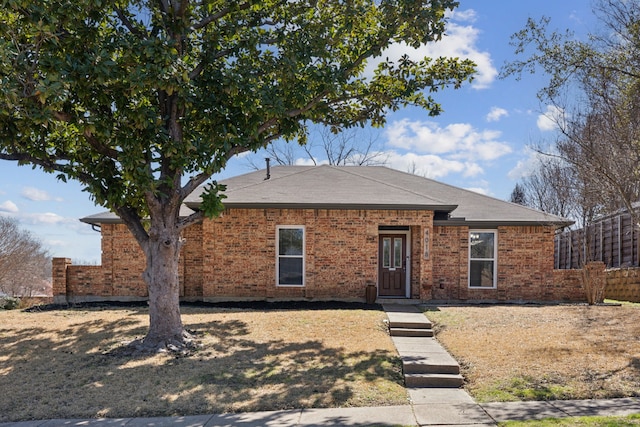 4018 Tobin Trl, Rowlett, TX 75088 - ranch-style house with fence, brick siding, and roof with shingles