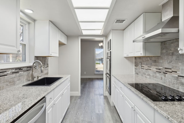 4018 Tobin Trl, Rowlett, TX 75088 - kitchen with a sink, wall chimney exhaust hood, appliances with stainless steel finishes, and white cabinets