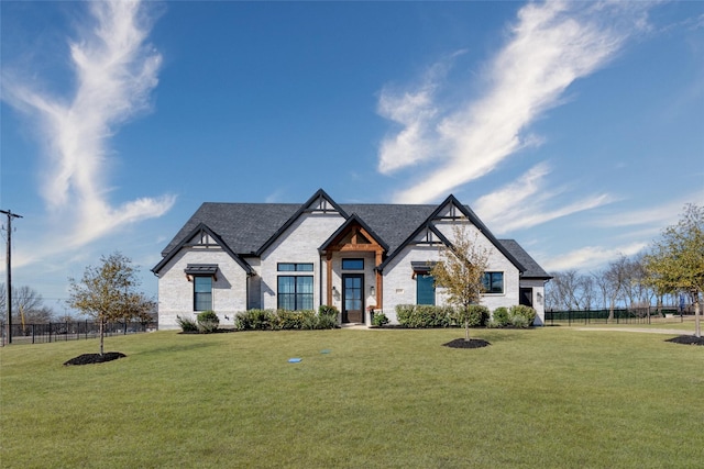 2652 Kessler Dr, Celina, TX 75009 - view of front facade with a shingled roof, a front yard, and fence