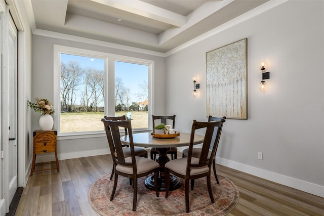 2652 Kessler Dr, Celina, TX 75009 - dining area with baseboards, a raised ceiling, and wood finished floors