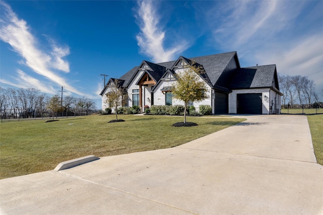 2652 Kessler Dr, Celina, TX 75009 - modern inspired farmhouse featuring a front lawn, an attached garage, concrete driveway, and stone siding