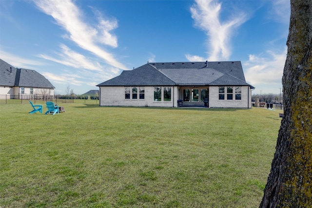 2652 Kessler Dr, Celina, TX 75009 - back of house featuring a lawn, roof with shingles, and fence