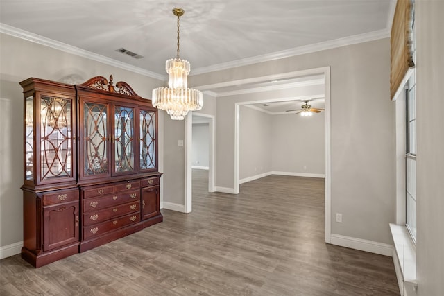 dining space featuring crown molding, baseboards, visible vents, and dark wood-style flooring