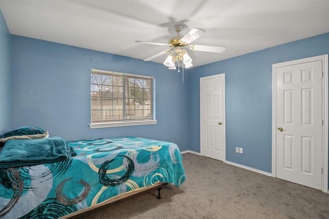 bedroom featuring carpet flooring, baseboards, and a ceiling fan