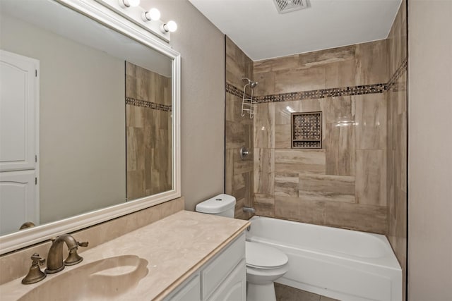 bathroom with bathing tub / shower combination, visible vents, vanity, and toilet