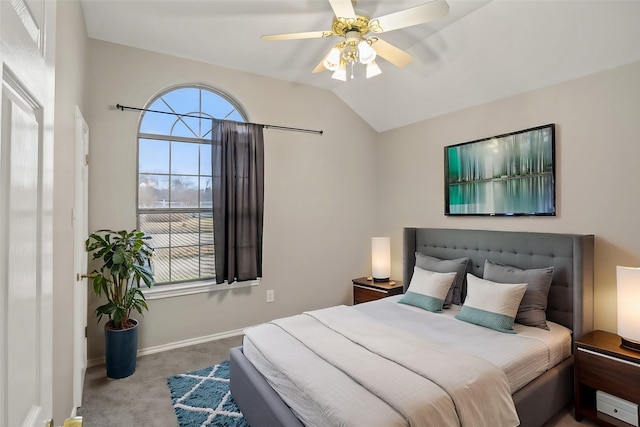 bedroom featuring ceiling fan, vaulted ceiling, carpet flooring, and baseboards