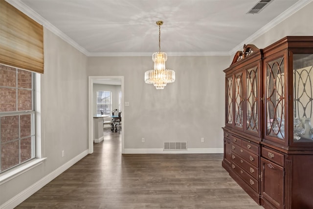 unfurnished dining area featuring a chandelier, dark wood finished floors, visible vents, and baseboards