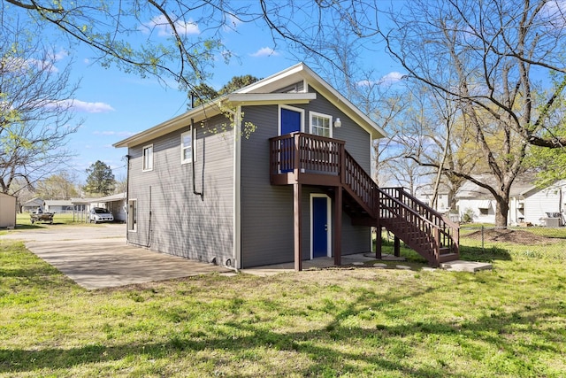 399 E College St, Alba, TX 75410 - back of property featuring stairway, fence, a lawn, a deck, and a patio area
