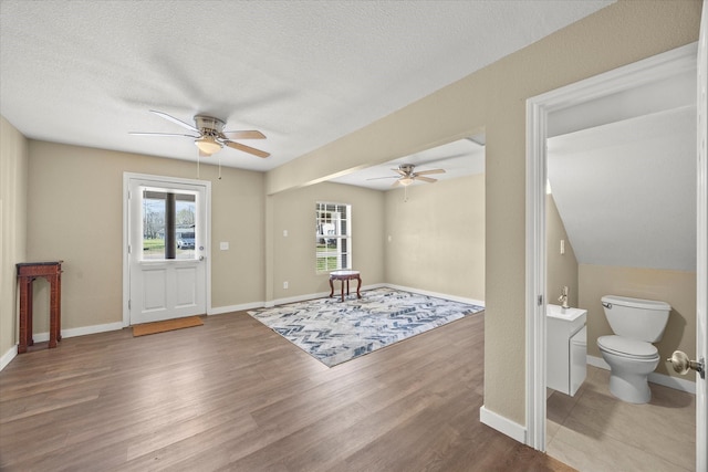 399 E College St, Alba, TX 75410 - foyer with a textured ceiling, ceiling fan, and wood finished floors