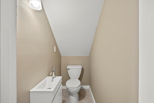 399 E College St, Alba, TX 75410 - half bathroom with baseboards, toilet, vanity, a textured wall, and tile patterned flooring