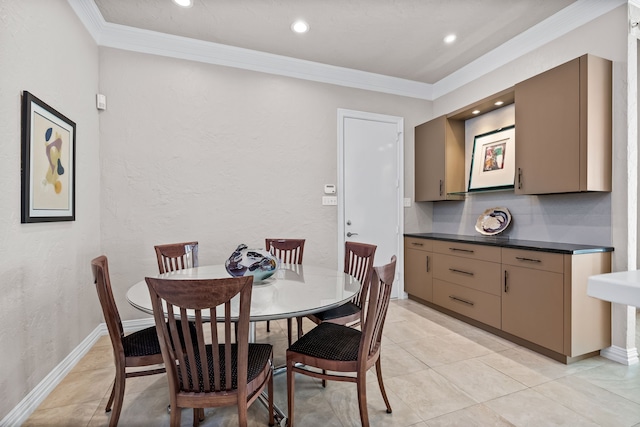 dining area featuring crown molding, recessed lighting, baseboards, and light tile patterned floors