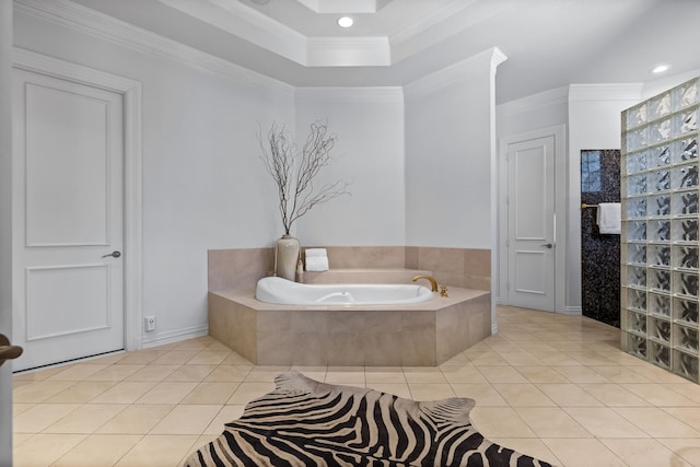bathroom with a bath, tile patterned flooring, ornamental molding, a tray ceiling, and recessed lighting