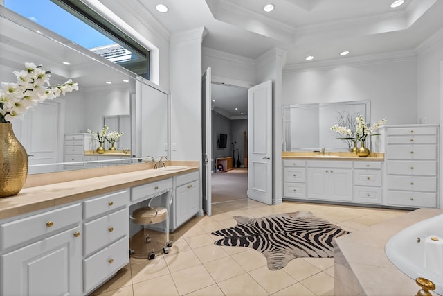 bathroom featuring a garden tub, crown molding, recessed lighting, tile patterned floors, and a tray ceiling