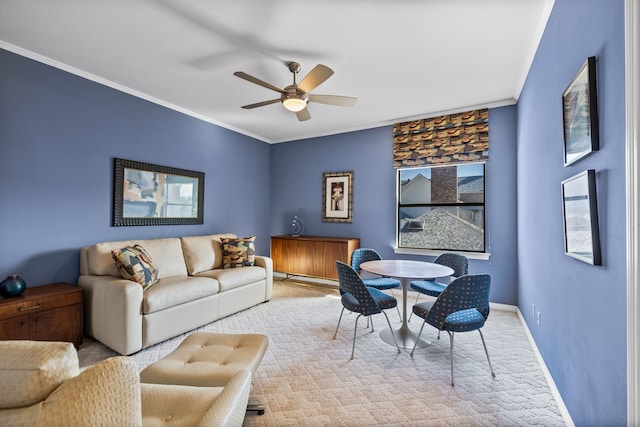 bedroom with crown molding, ceiling fan, and light colored carpet