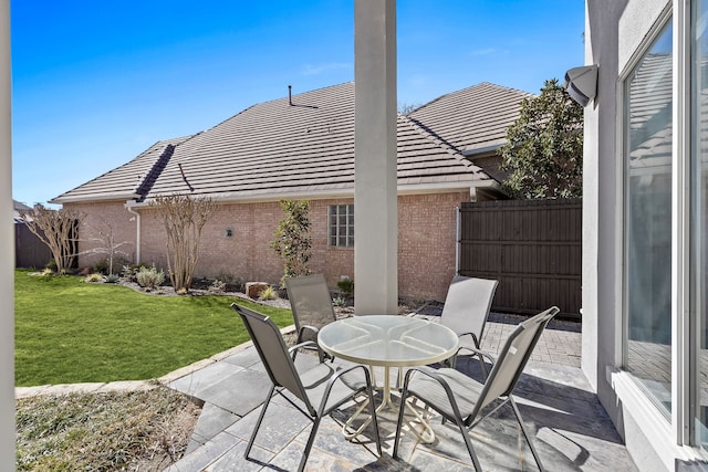 view of patio featuring fence