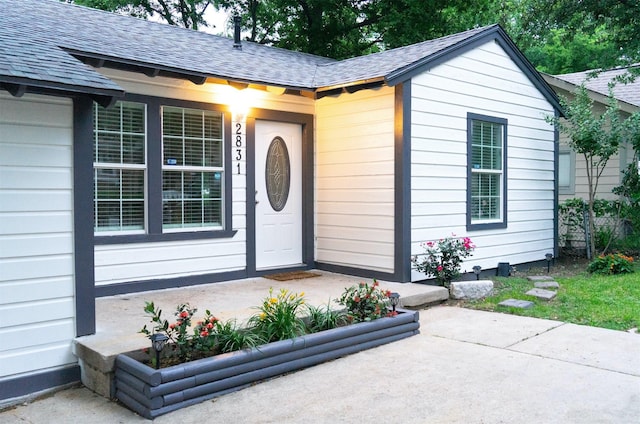 2831 Aster St, Dallas, TX 75211 - property entrance featuring a shingled roof