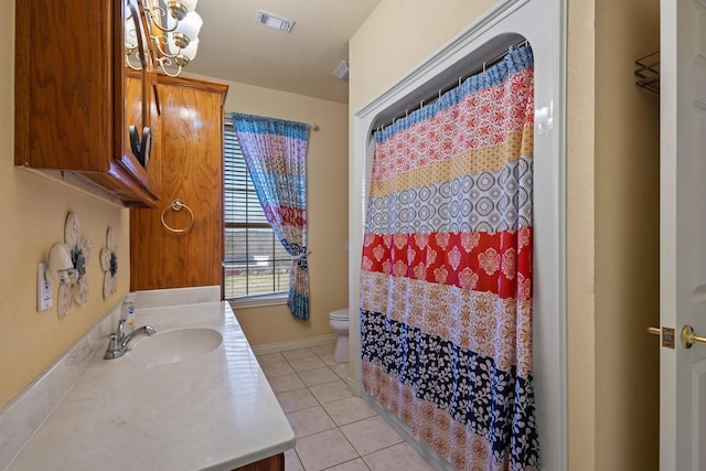 bathroom with vanity, visible vents, toilet, tile patterned flooring, and a notable chandelier
