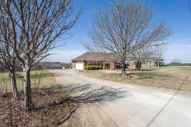 view of street with aphalt driveway