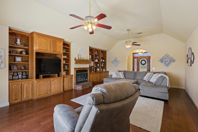 living room with visible vents, lofted ceiling, dark wood-type flooring, and a ceiling fan