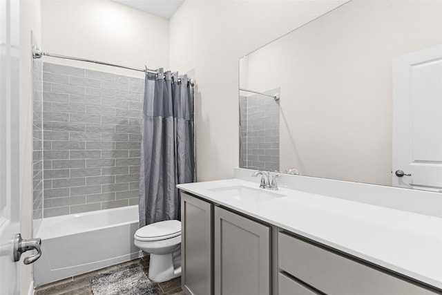 bathroom with toilet, vanity, wood finish floors, and shower / bathtub combination with curtain