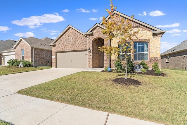 view of front of property featuring a front yard, a garage, brick siding, and driveway