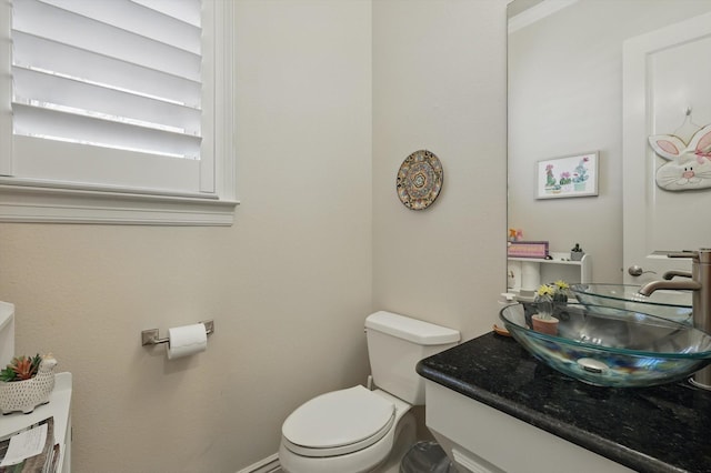 12265 Indian Creek Dr, Fort Worth, TX 76179 - half bathroom with toilet, vanity, and baseboards