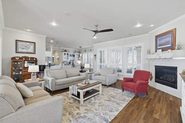 12265 Indian Creek Dr, Fort Worth, TX 76179 - living area featuring crown molding, recessed lighting, a ceiling fan, and a glass covered fireplace