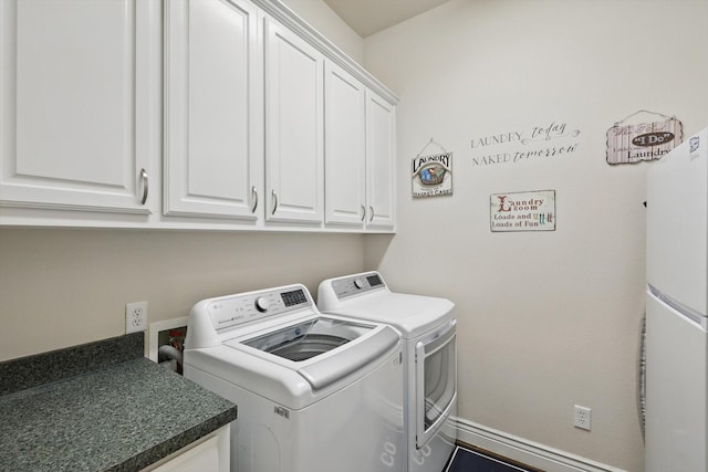 12265 Indian Creek Dr, Fort Worth, TX 76179 - clothes washing area with baseboards, cabinet space, and washing machine and dryer