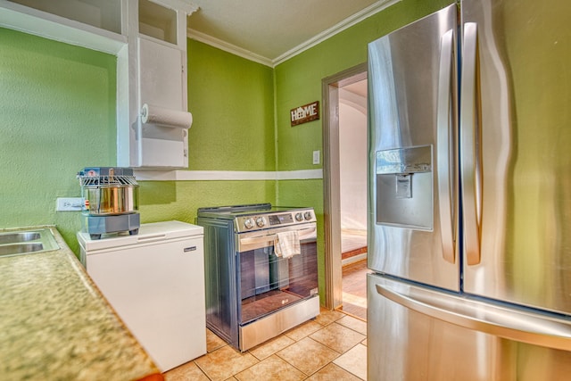 kitchen with light tile patterned floors, light countertops, appliances with stainless steel finishes, crown molding, and a textured wall