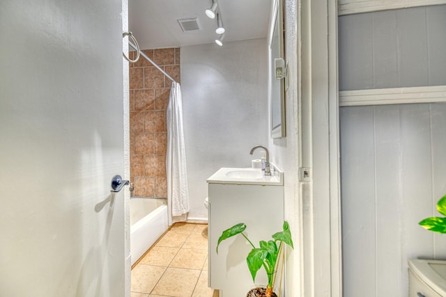 full bathroom featuring tile patterned flooring, visible vents, toilet, and vanity