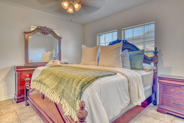 tiled bedroom featuring ceiling fan