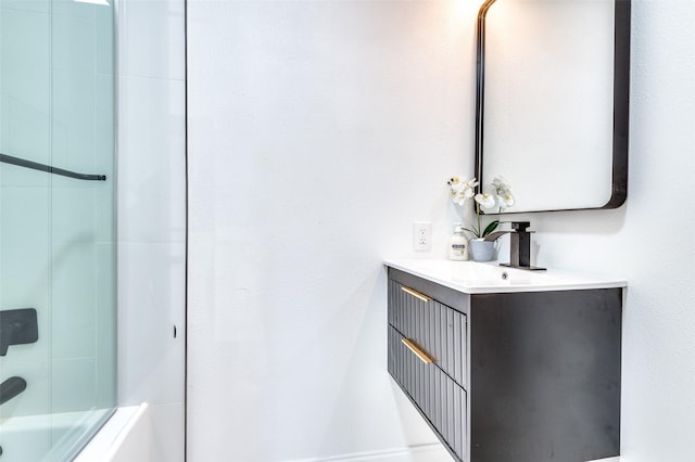 bathroom featuring shower / washtub combination and vanity