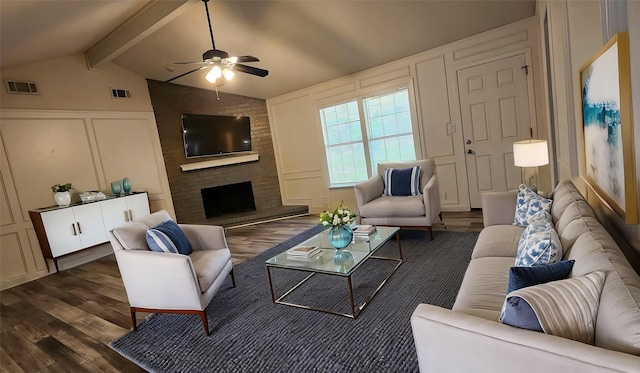 5919 Pleasant Hill Dr, Arlington, TX 76016 - living room with a decorative wall, dark wood finished floors, a ceiling fan, and a brick fireplace