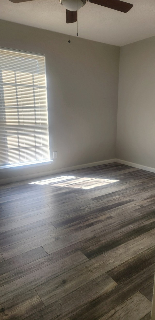 5919 Pleasant Hill Dr, Arlington, TX 76016 - spare room featuring a ceiling fan, dark wood-type flooring, and baseboards