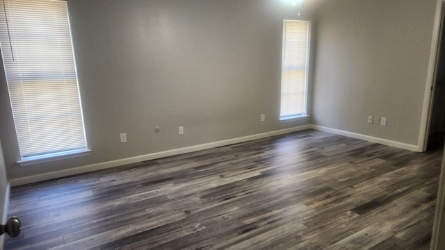5919 Pleasant Hill Dr, Arlington, TX 76016 - unfurnished room with baseboards and dark wood-style flooring