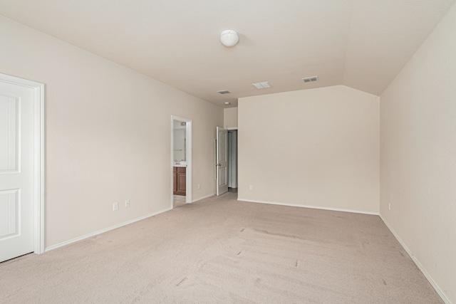 unfurnished room featuring light colored carpet, visible vents, and baseboards