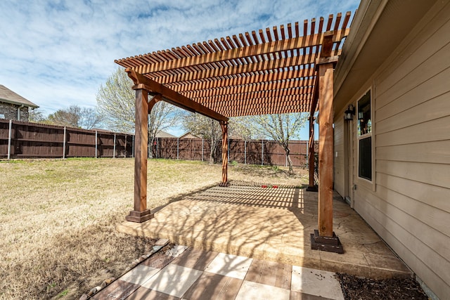 view of patio with a pergola and a fenced backyard