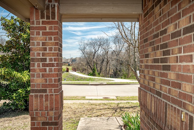 exterior space with brick wall