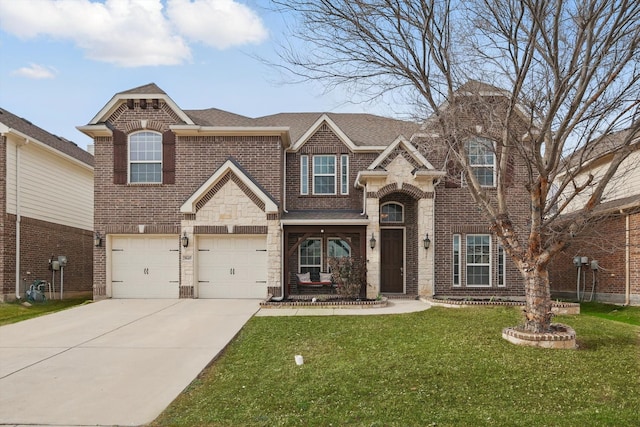 view of front facade featuring brick siding, a shingled roof, a front yard, a garage, and driveway