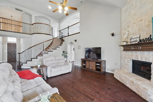 9645 Salvia Dr, Fort Worth, TX 76177 - living area with arched walkways, stairway, ceiling fan, a towering ceiling, and hardwood / wood-style floors