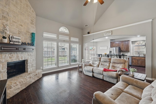 9645 Salvia Dr, Fort Worth, TX 76177 - living area featuring a ceiling fan, dark wood finished floors, high vaulted ceiling, and a stone fireplace