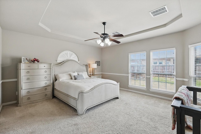 9645 Salvia Dr, Fort Worth, TX 76177 - carpeted bedroom with a tray ceiling and ceiling fan
