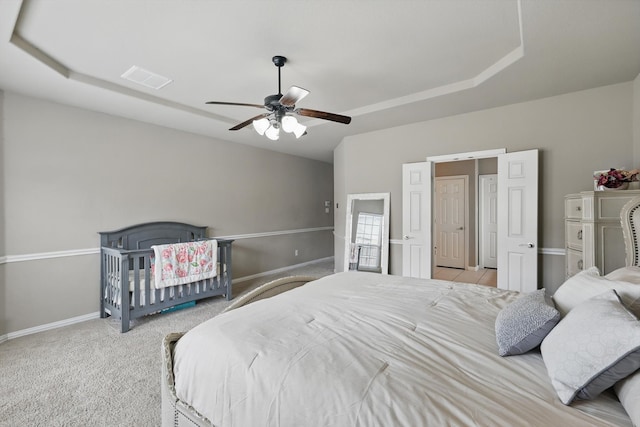9645 Salvia Dr, Fort Worth, TX 76177 - carpeted bedroom with a raised ceiling and a ceiling fan