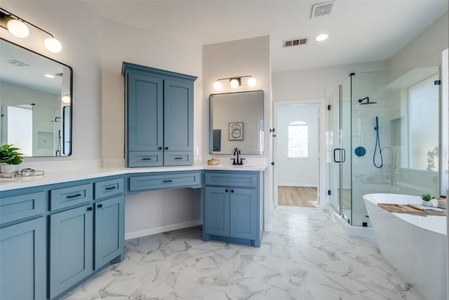 bathroom featuring a shower stall, vanity, visible vents, and a soaking tub