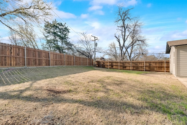 view of yard with a fenced backyard