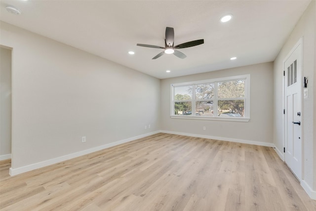 empty room featuring recessed lighting, a ceiling fan, baseboards, and light wood finished floors