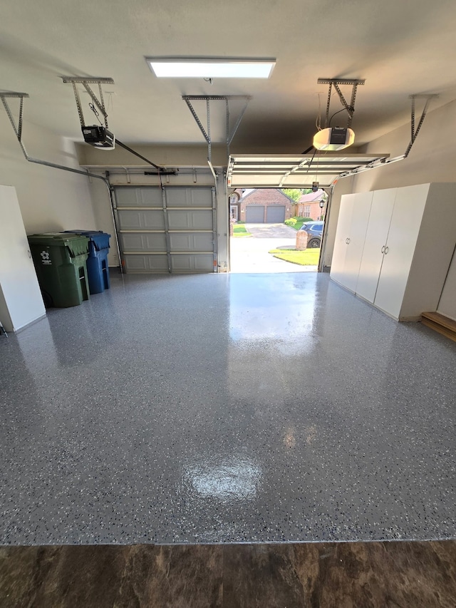 2300 Henley Ct, Flower Mound, TX 75028 - garage featuring a garage door opener