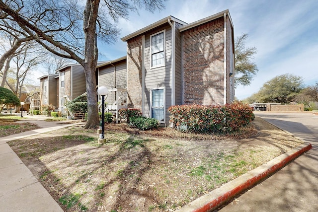 view of home's exterior featuring brick siding