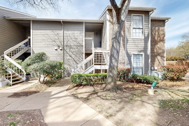 view of property featuring stairway